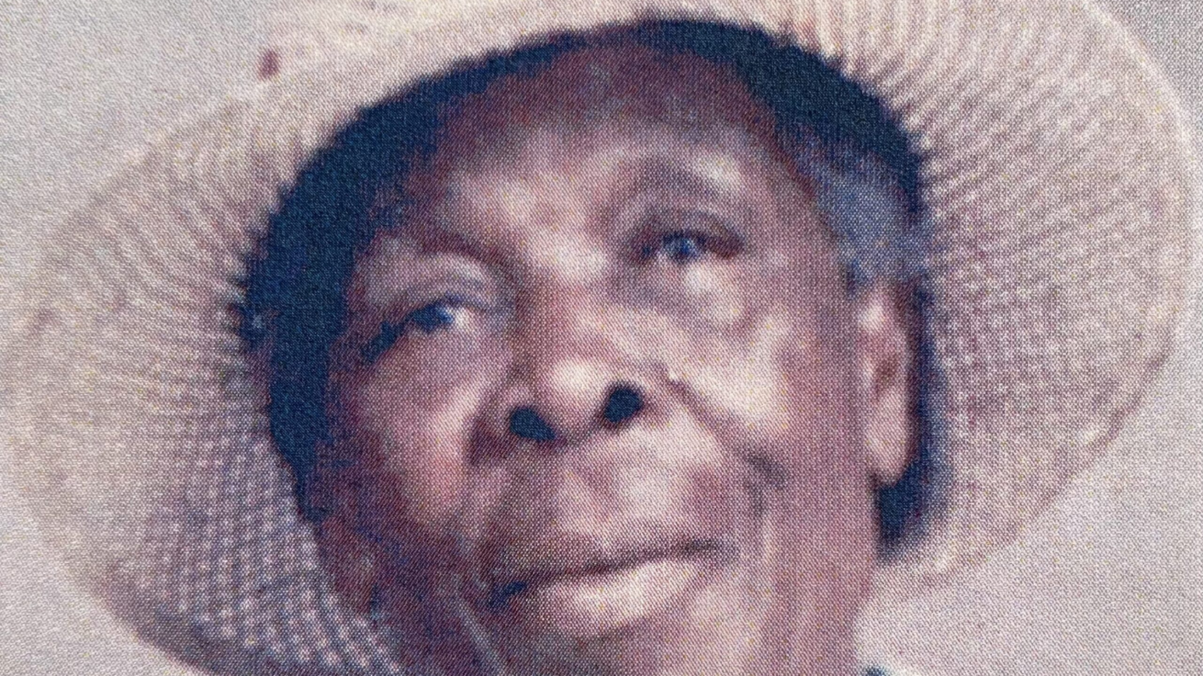 Portrait of Elmenia Rebecca Williams, known as Ma Mena, wearing a straw hat