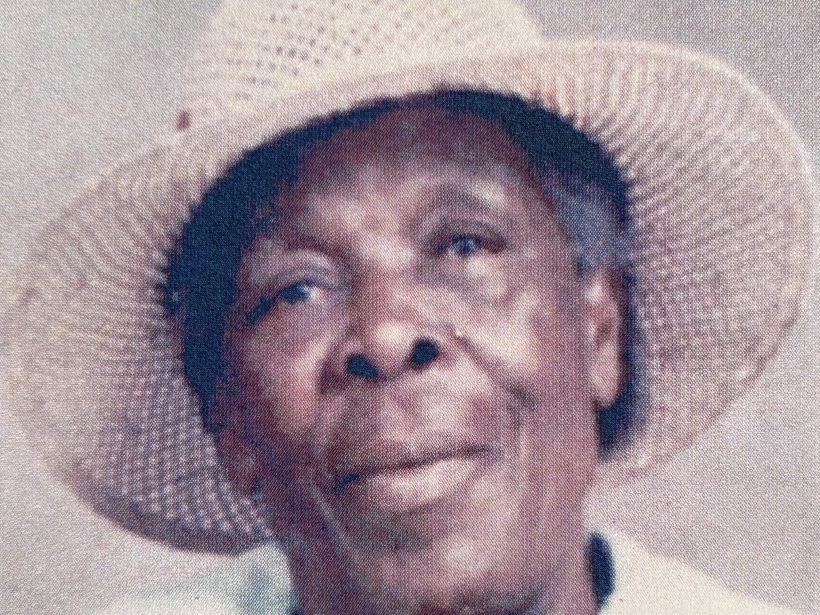 Portrait of Elmenia Rebecca Williams, known as Ma Mena, wearing a straw hat